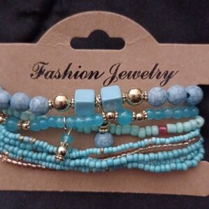 (4) NWOT BOHO STACKABLE TURQUOISE BLUE AND GOLD STRETCHABLE BRACELETS 7" AND 8".